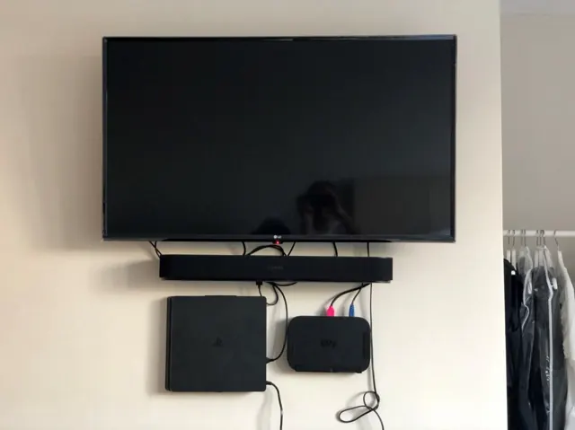 TV, soundbar, Sky box and games console wall mounted with tidy cabling